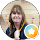 Smiling woman with shoulder-length hair, WhatsApp icon overlay.